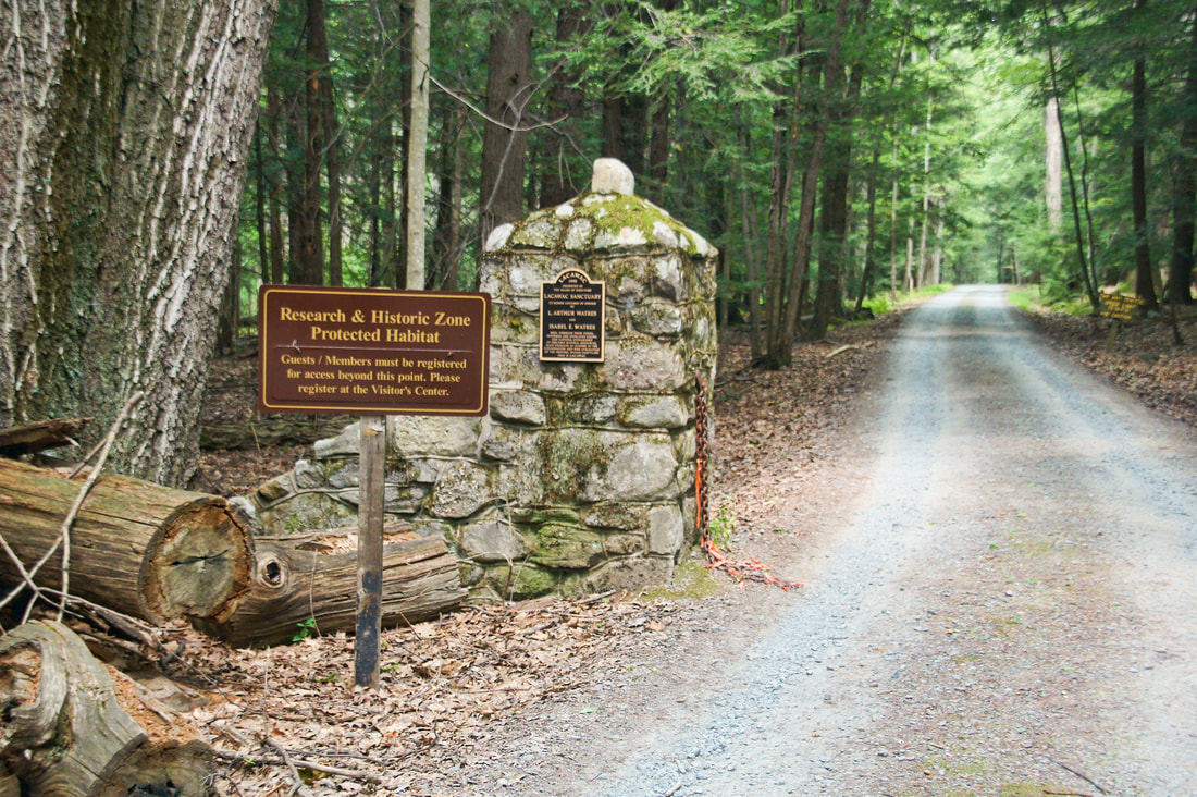 Historic Great Camp A sign at the entrance of Lacawac Sanctuary stating its protected habitat status