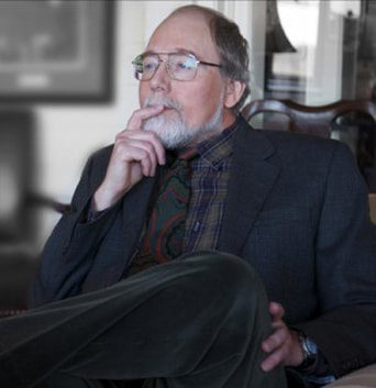Portrait of Dr. Robert E. Moeller sitting in a chair