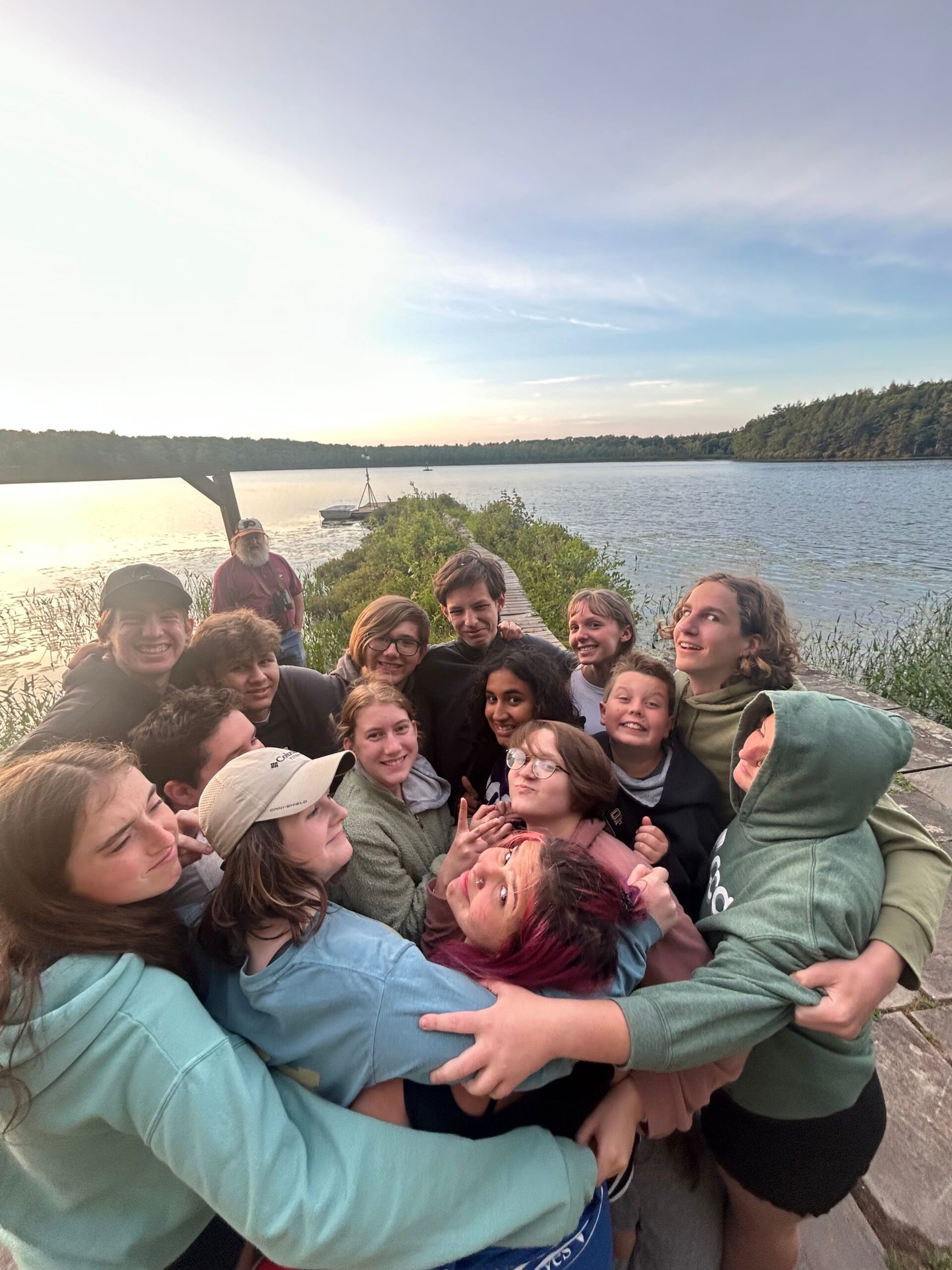 Happy group of young people posing by Lake Lacawac dock at sunset. Happy group of young people posing by Lake Lacawac dock at sunset.