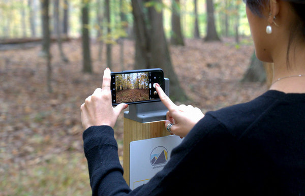 chronolog_orig A person taking photos on a smart phone