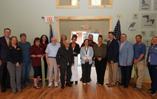 Community leaders posing after the ribbon cutting