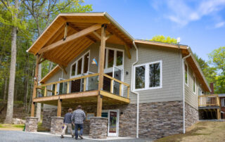 Wide view of the new education center building exterior with guests in foreground.
